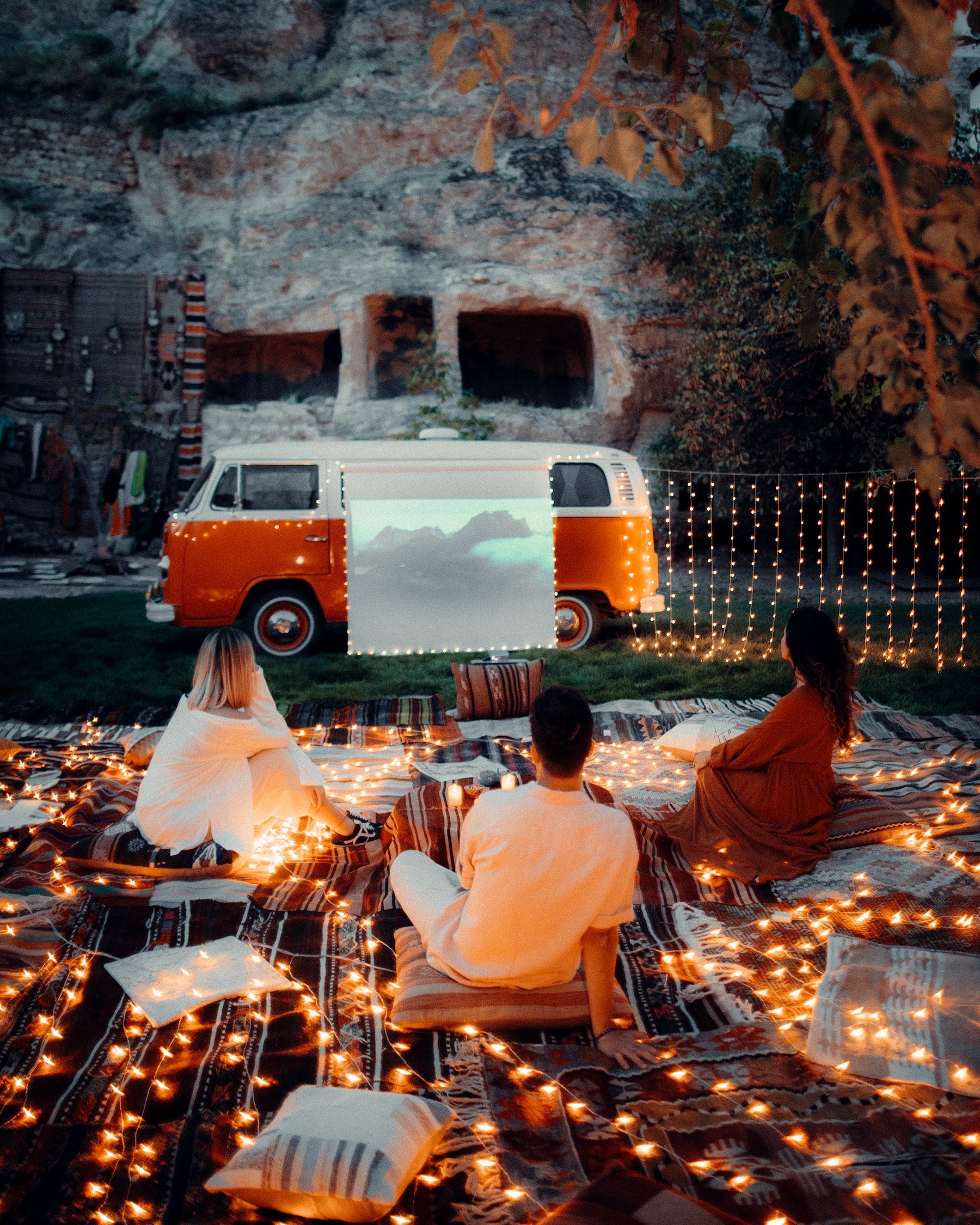 Campers watching a movie with a generator for camping