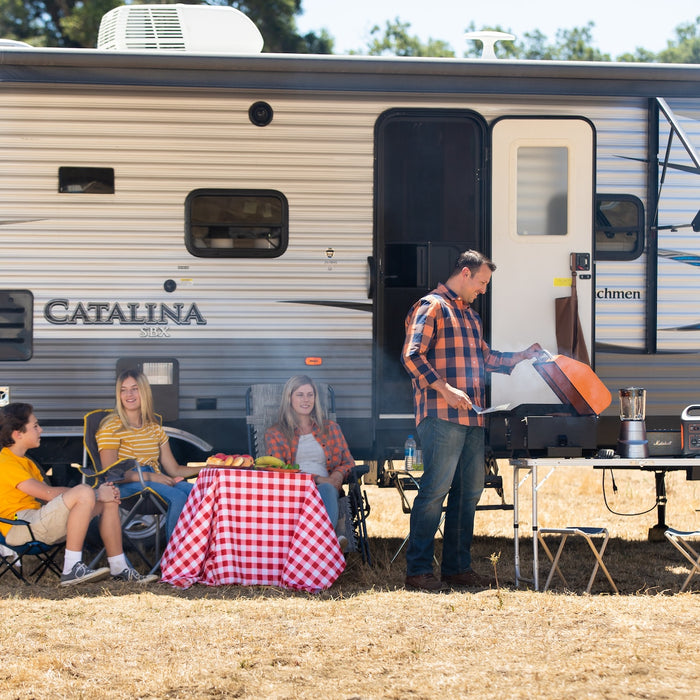 Portable generator with camper and a family
