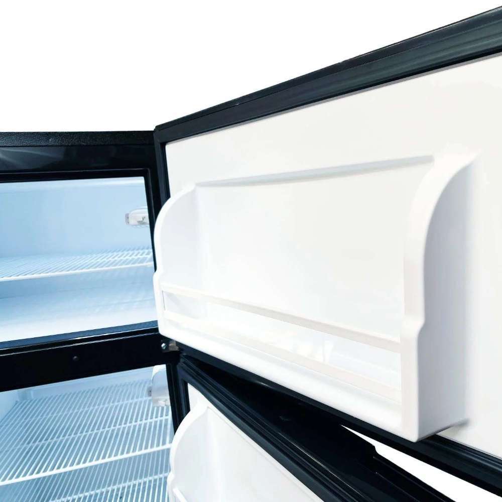 Door interior view shows SunStar ST-16RF-SS 16 cu.ft. DC/AC Refrigerator - Stainless Steel with a deep white plastic storage bin