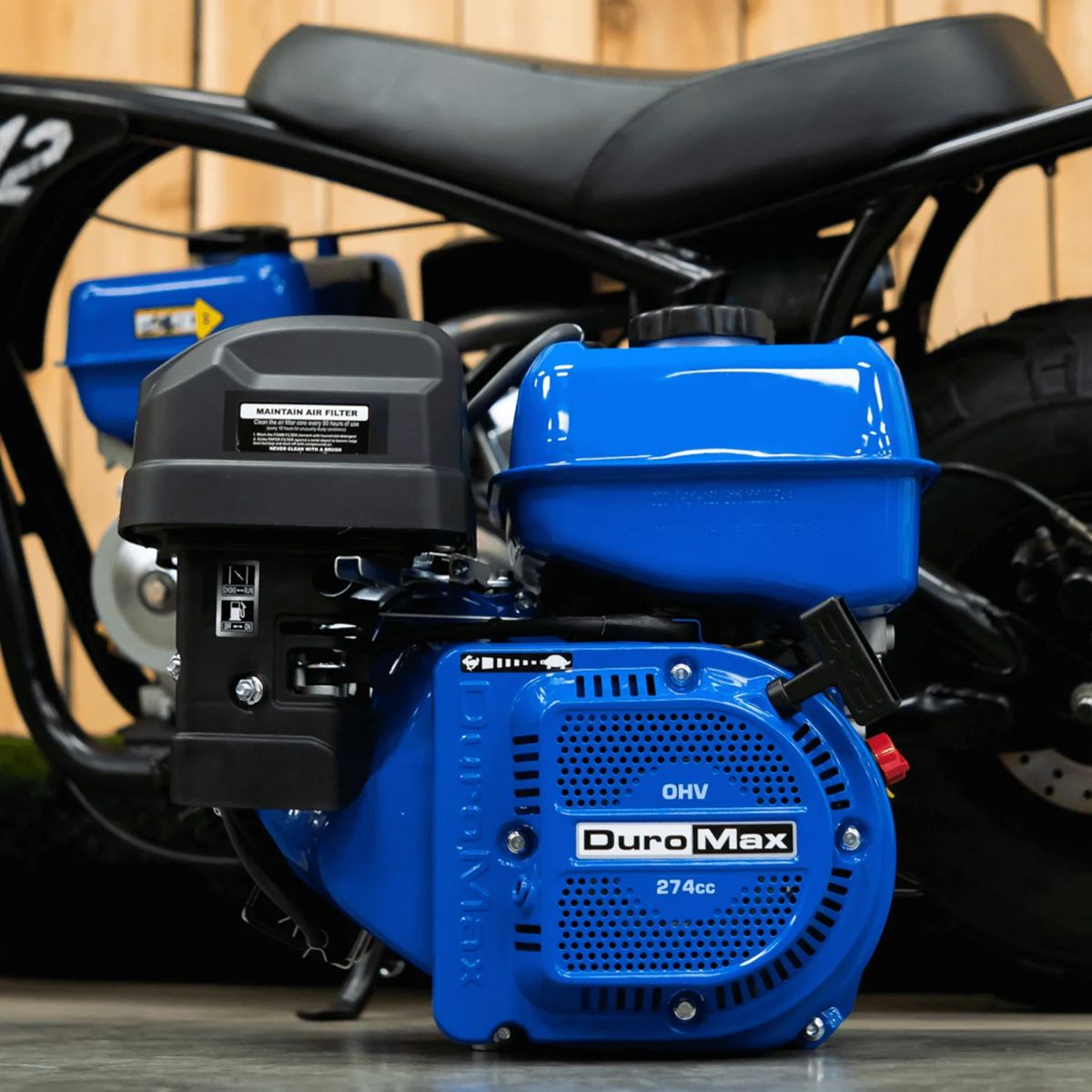 Foccused view of DuroMax XP9HP along side a motorized vehicle