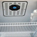 Inside the SunStar ST-10RF-SS 10 cu.ft. DC/AC Refrigerator - Stainless Steel, a cooling fan, temperature dial, and wire shelf are visible