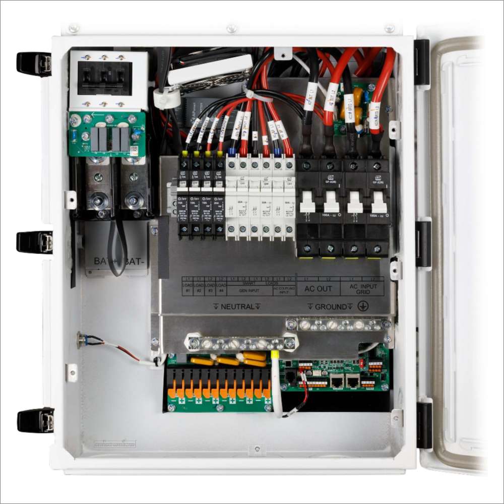 MidNite Power MN15-12KW-AIO AC Output Hybrid All-in-One Inverter interior shows organized wiring, breakers, and terminals inside a white metal enclosure