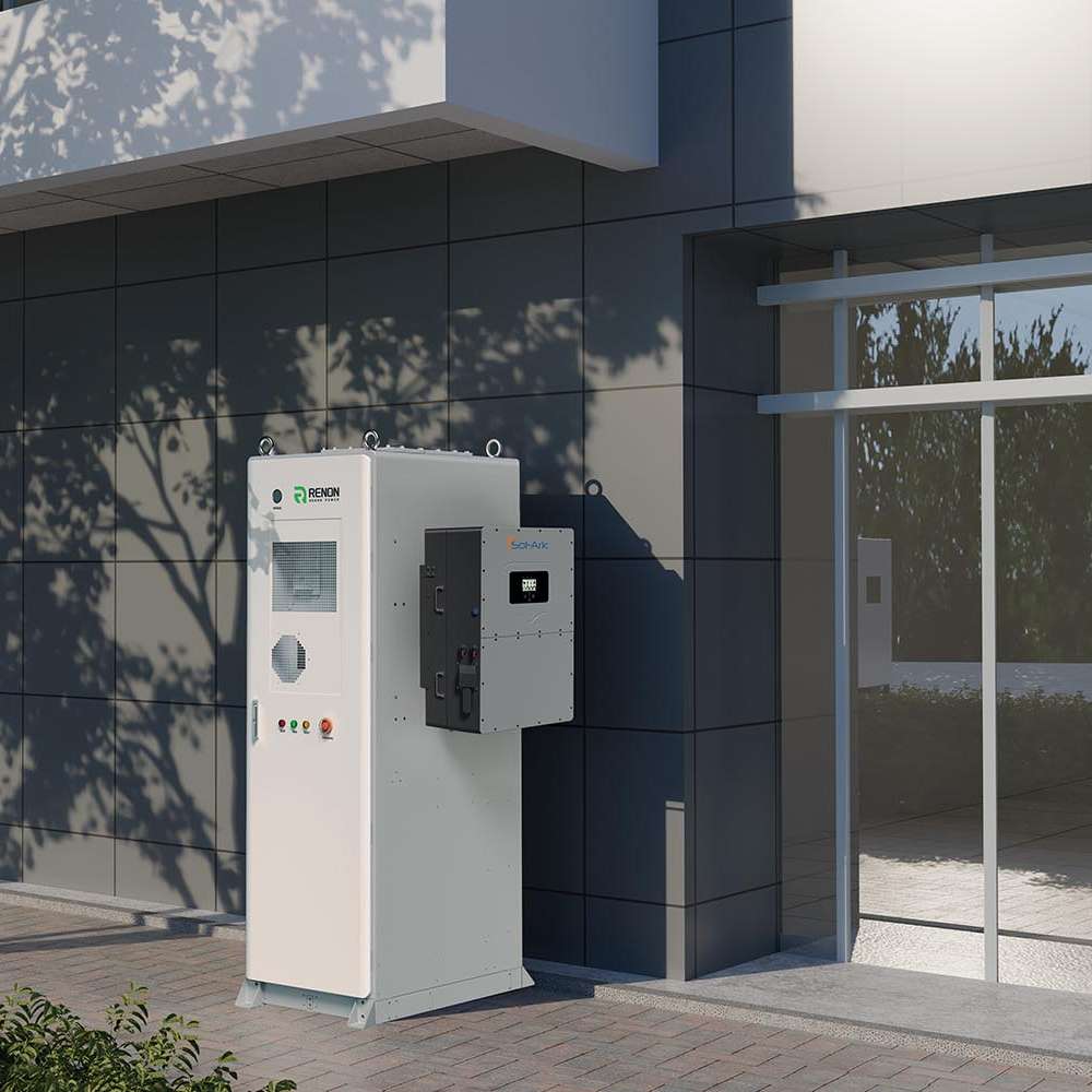 Renon Power ECube 60AP 61kWh Lithium Battery System-ECUBE61K is installed outdoors beside a modern building, connected to a wall-mounted inverter unit