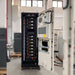 Renon Power ECube 60AP 61kWh Lithium Battery System-ECUBE61K is pictured open from the front, clearly showing organized battery racks, wiring, and control hardware