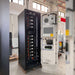 Renon Power ECube 60AP 61kWh Lithium Battery System-ECUBE61K is shown with its door open, revealing stacked battery modules and internal electrical components inside a black cabinet