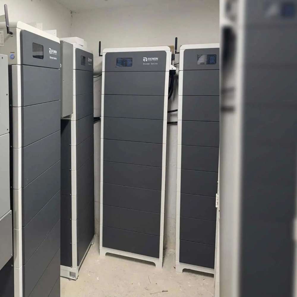 Renon Power Xtreme HV Series 5.12kWh Stackable Battery Module-XTREMEHVS5K shown as multiple tall battery cabinets lined up side by side inside a clean utility room