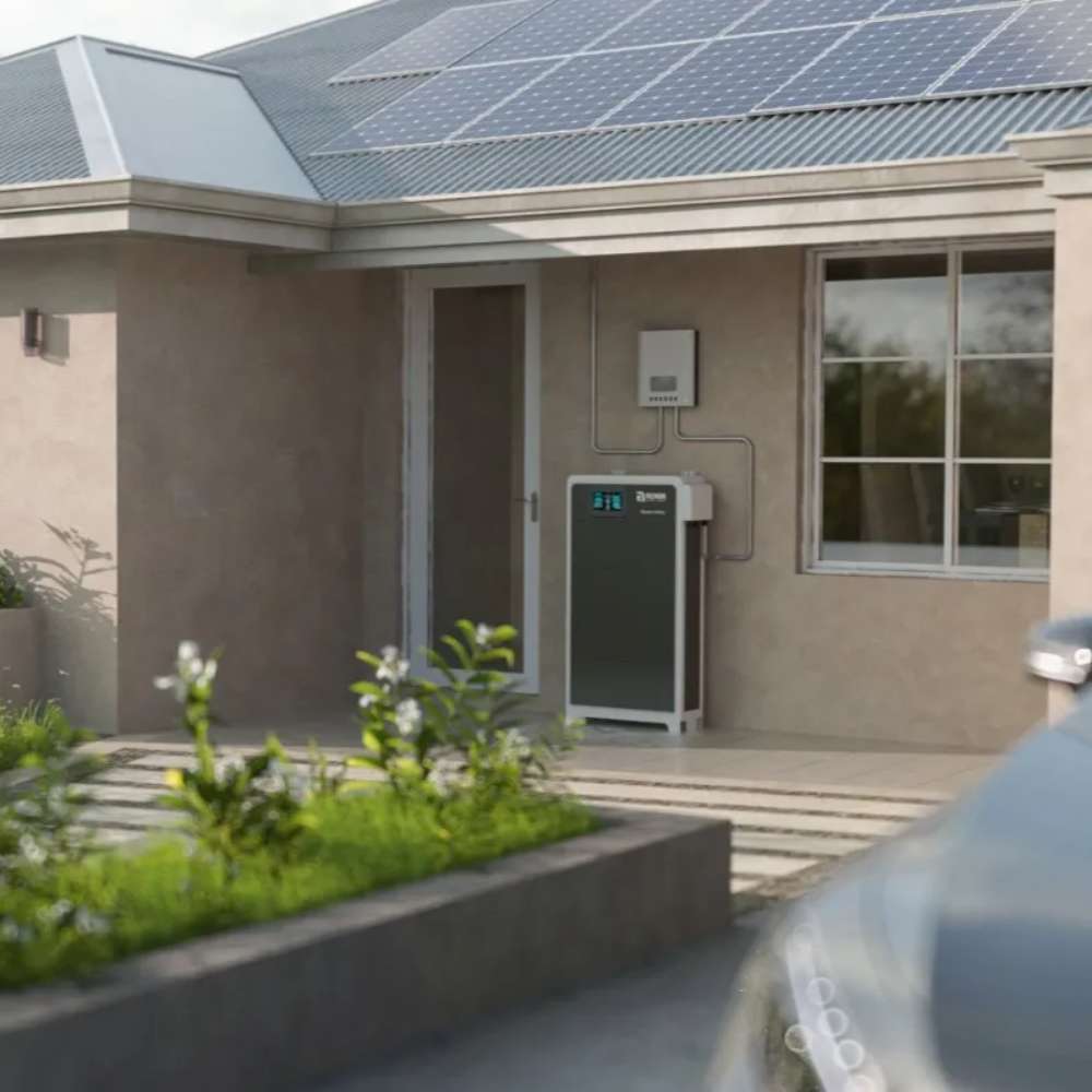Renon Power Xtreme LV Series 5.12KWh Modular Residential Battery Module-XTREMELVS5K is installed outside a house near solar panels, showing its use with a residential solar energy system