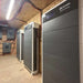 Renon Power Xtreme LV Series 5.12KWh Stackable Battery Module-XTREMELVBCU is shown in a power room with multiple stacked units and wall-mounted inverters