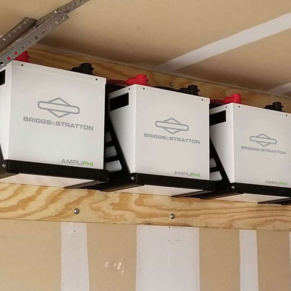 Simpliphi by Briggs & Stratton AMPLIPHI-3.8-48 48 Volt 3.8kWh Lithium Battery shown installed side by side on a wooden wall support inside a utility or storage space
