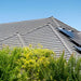 Solar panels on a gray tile roof that can connect to the Magnum Energy CSW Series CSW2024 2000W 24VDC Pure Sine Wave Inverter