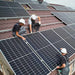 Workers install rooftop solar panels connected to the Victron Energy 12.8V 200Ah NG Smart LiFePO4 Lithium Battery-BAT512120620