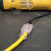 The connecting ends of a 50ft heavy-duty DuroMax extension cord with a clear lighted power indicator, perfect for use with quality generators and portable generators.