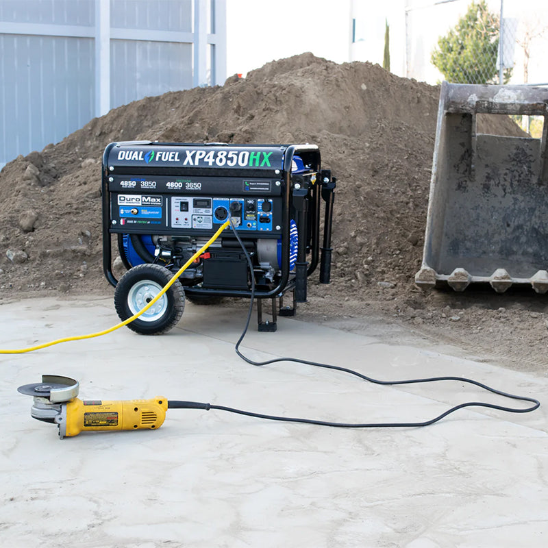 DuroMax XP4850HX generator providing power to construction tools on a site, emphasizing its portability and power in demanding work environments.