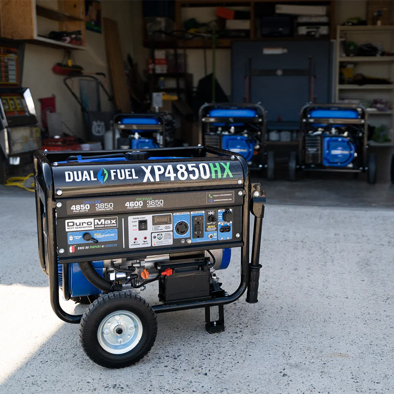 DuroMax XP4850HX dual fuel portable generator positioned in a garage, indicating readiness for quality power backup or project use.