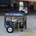 Duromax XP4850HX portable generator being used in a garage, showcasing its quality generator capabilities with dual fuel option.