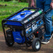 Man pulling a Duromax XP4850HX portable generator through a garden, emphasizing the mobility of quality generators.