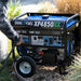 DuroMax XP4850HX generator connected to a propane tank in an outdoor setting, showcasing its versatility and quality construction.