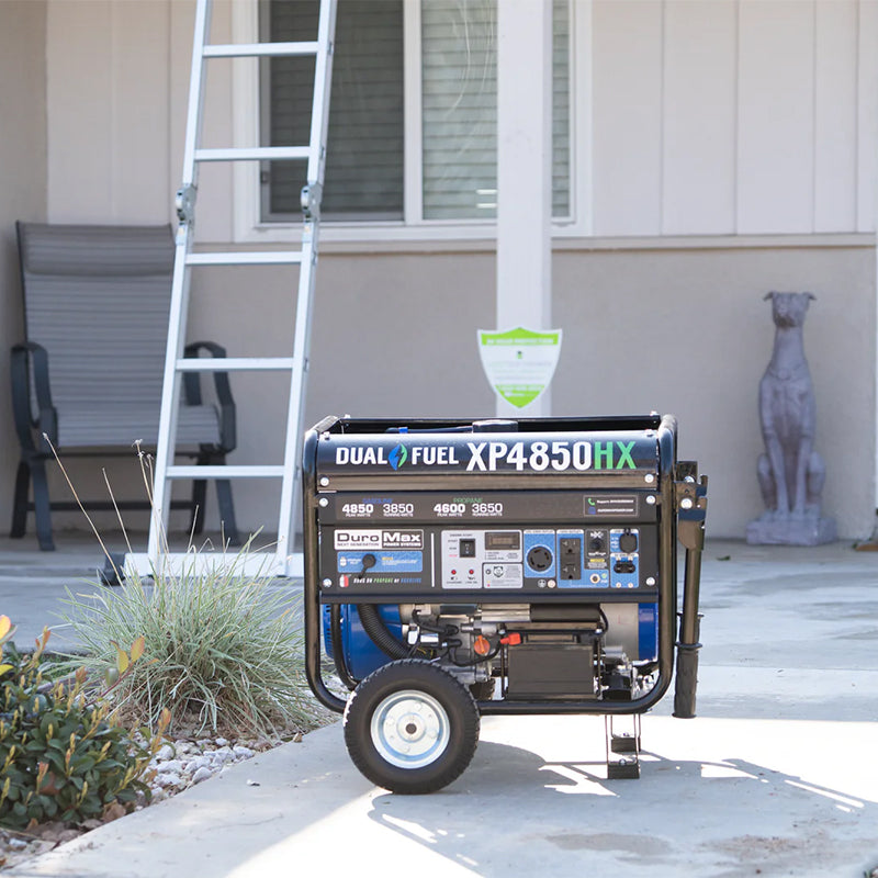 DuroMax XP4850HX portable generator on display in a driveway, illustrating its practicality for home power backup needs.