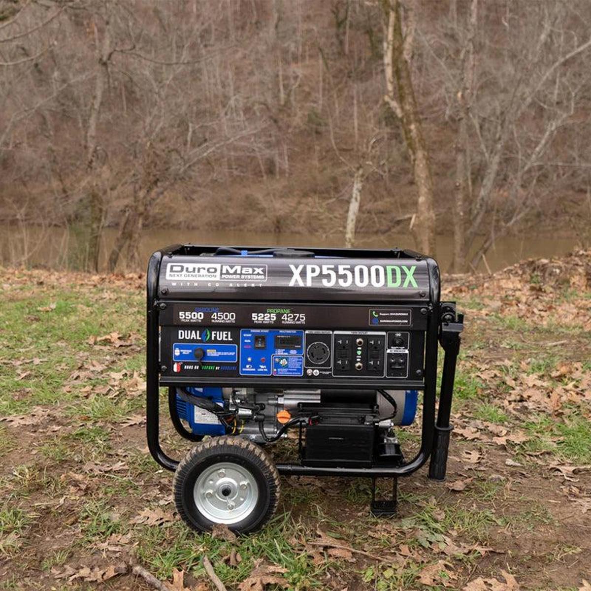 Duromax XP5500DX quality generator set up in an outdoor setting near a creek.