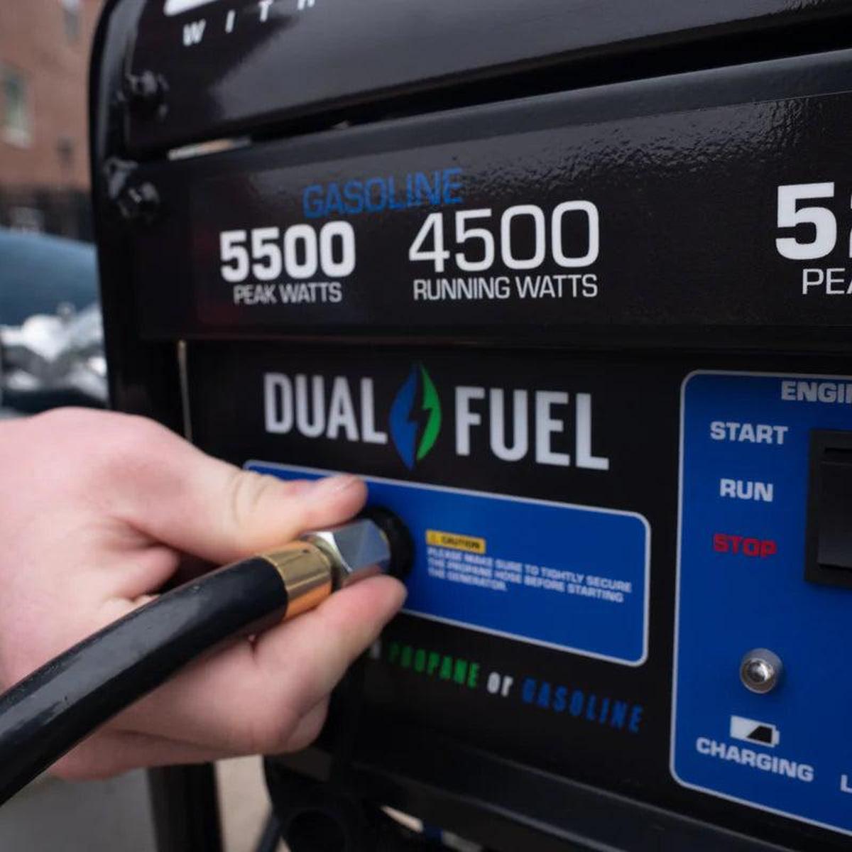 Hand connecting a propane hose to a Duromax XP5500DX dual fuel quality generator.