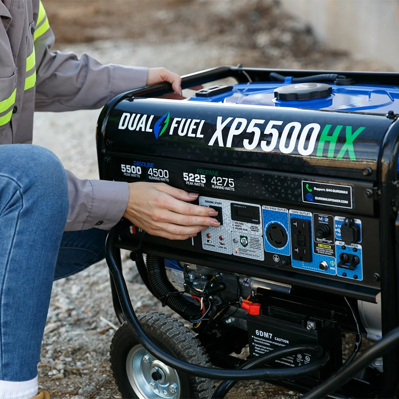 A person adjusting settings on a Duromax XP5500HX portable generator, highlighting its easy-to-use control panel.