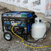 Duromax XP5500HX generator operating with a propane tank on a construction site, showing its efficiency and reliability.