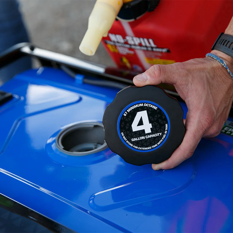 Pouring fuel into a Duromax XP5500HX portable generator, emphasizing the ease of refueling for extended use.