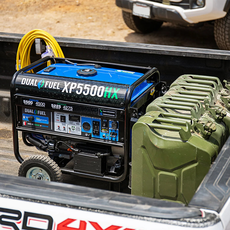 Portable Duromax XP5500HX generator loaded in a truck bed, ideal for outdoor and remote power requirements.