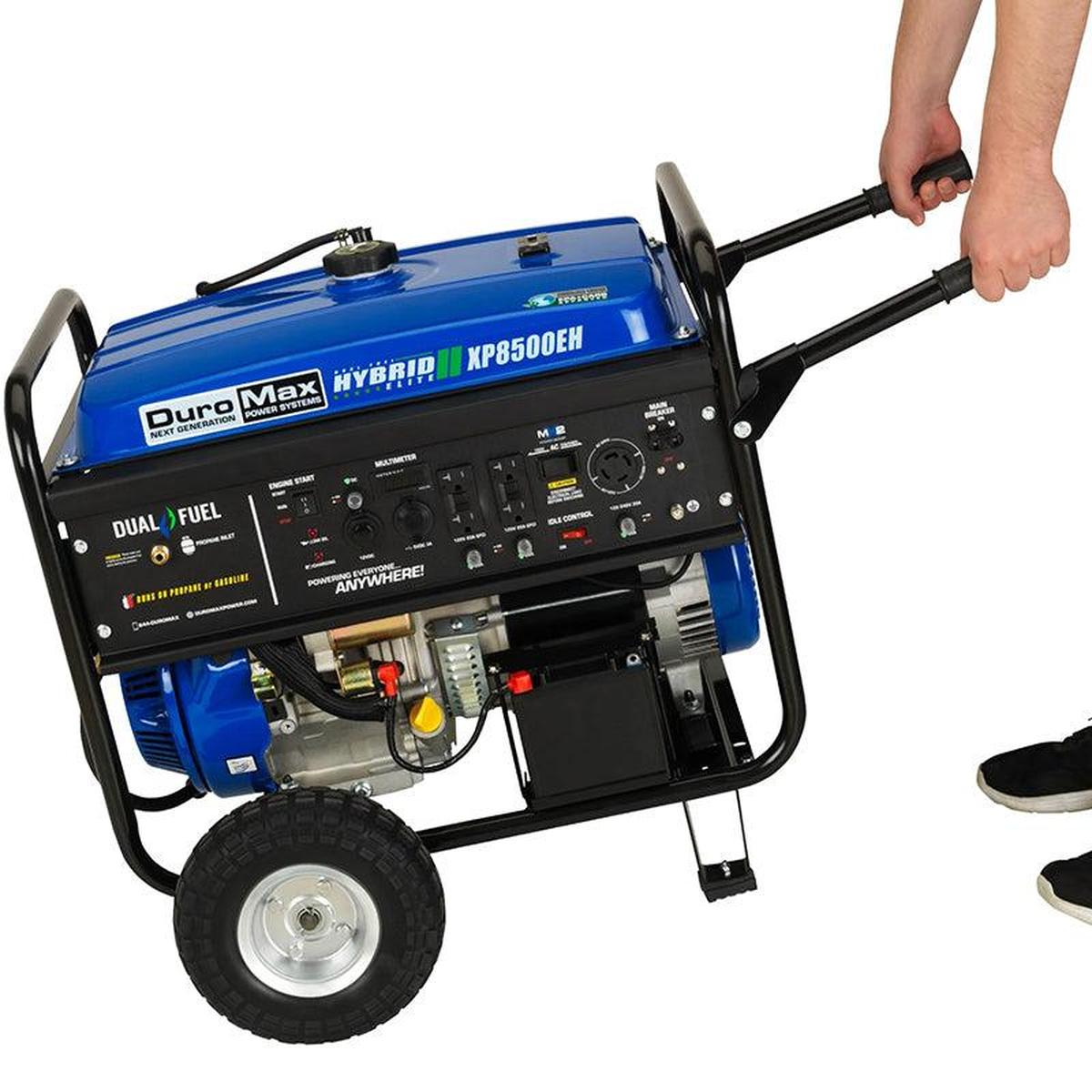 Side view of DuroMax XP8500EH dual fuel portable generator with pull handle for easy transportation.