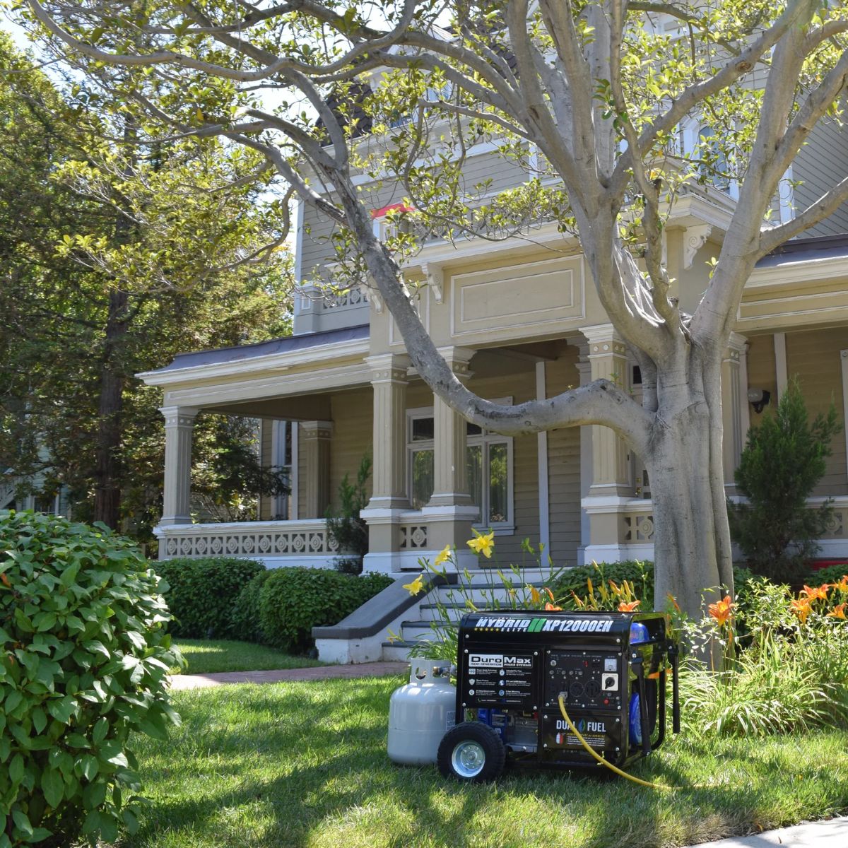 DuroMax XP12000EH with propane tank in front the house