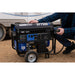 The owner setting up the power cable to hook up to DuroMax XP7500X