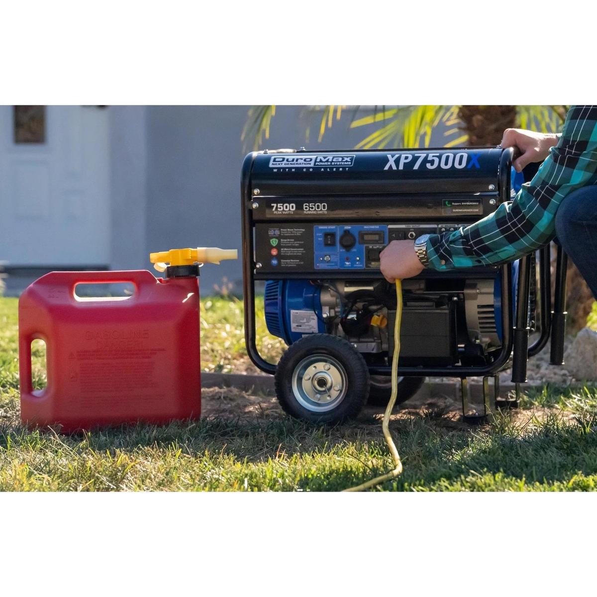 Hooking up the cable to the DuroMax XP7500X  with its reserved gasoline fuel