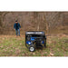 Duromax XP7500X outside with its owner displaying portability