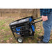 A person pushing a Duromax XP7500X portable generator, showcasing its user-friendly portability.