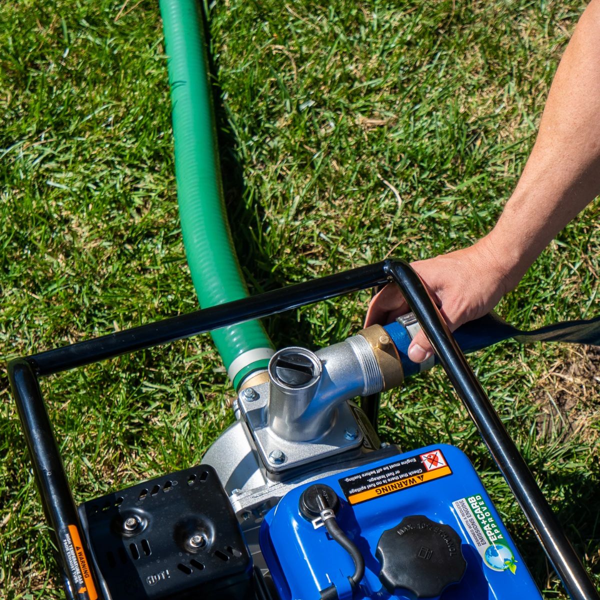 DuroMax XPH0350D Water Discharge Hose connected to the discharge port and water pump hose connected to inlet port of a DuroMax Outdoor Engine Pump