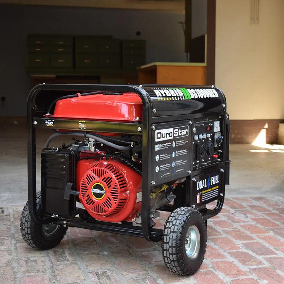 A distant view of the DuroStar DS10000EH quality generator positioned on a suburban driveway, showcasing its portability and compact size.