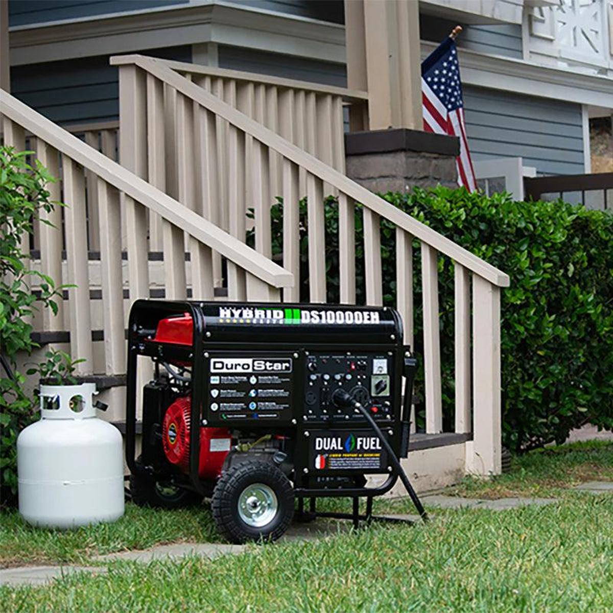 DuroStar DS10000EH dual fuel generator, featuring sturdy wheels and compact design, perfect for portable power needs in various locations.