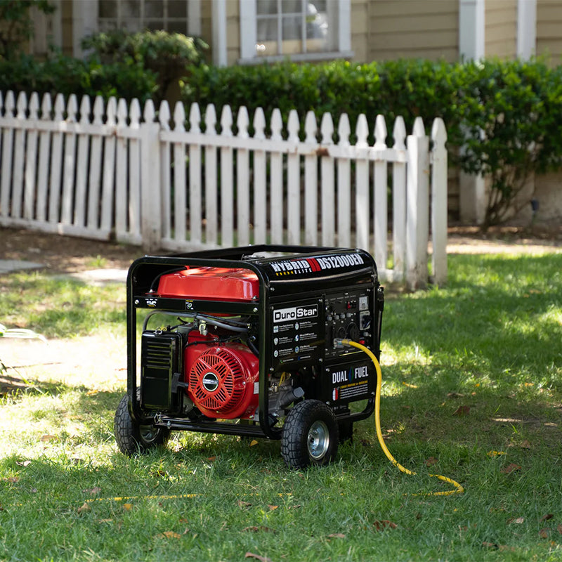 Quality generator, the DuroStar DS12000EH, set up on a residential lawn, demonstrating its portability and functionality.