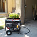 DuroStar DS12000EH positioned in a driveway, a convenient and portable generator for home use.