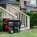 Quality generator, DuroStar DS12000EH, displayed in front of a home, showcasing its role as a reliable portable generator.