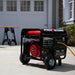 Portable generator, DuroStar DS12000EH, in use at a home construction site, showcasing its utility for power tools.