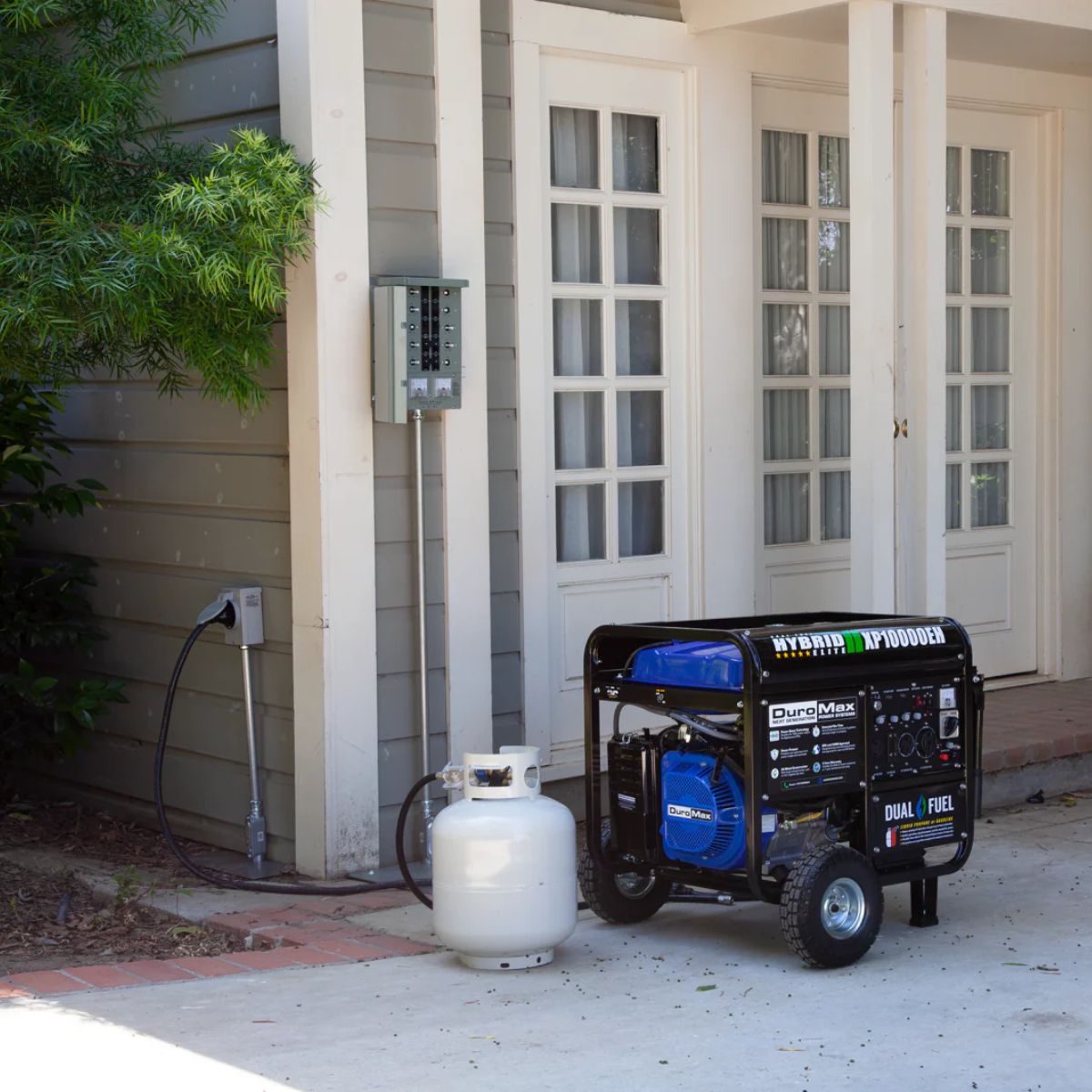 Propane powered set up of DuroStar XP10000EH hooked up outside the backhouse