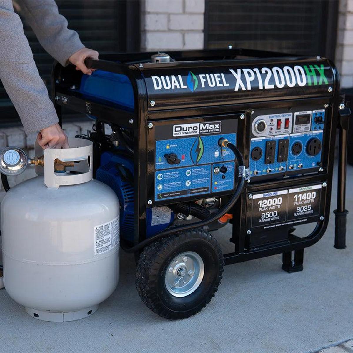 Man connecting propane tank to quality generator, showcasing the versatility of Duromax dual-fuel portable generators.