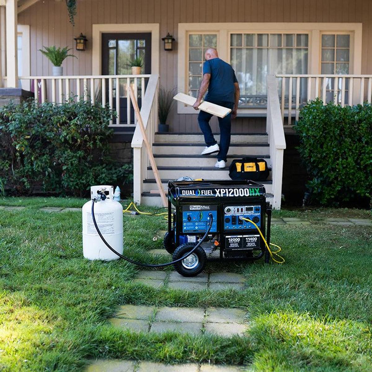 Man preparing a Duromax portable generator for operation, exemplifying a quality generator solution for residential power needs.