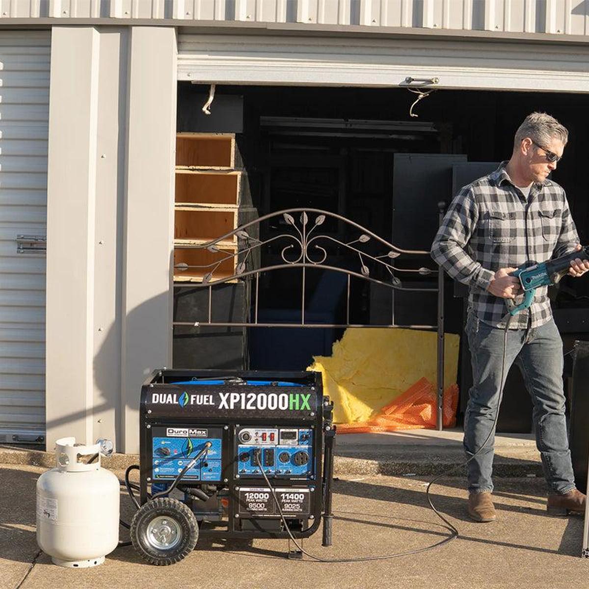 DuroMax XP12000HX portable generator being used during a renovation project, illustrating the generator's high power output and reliability.