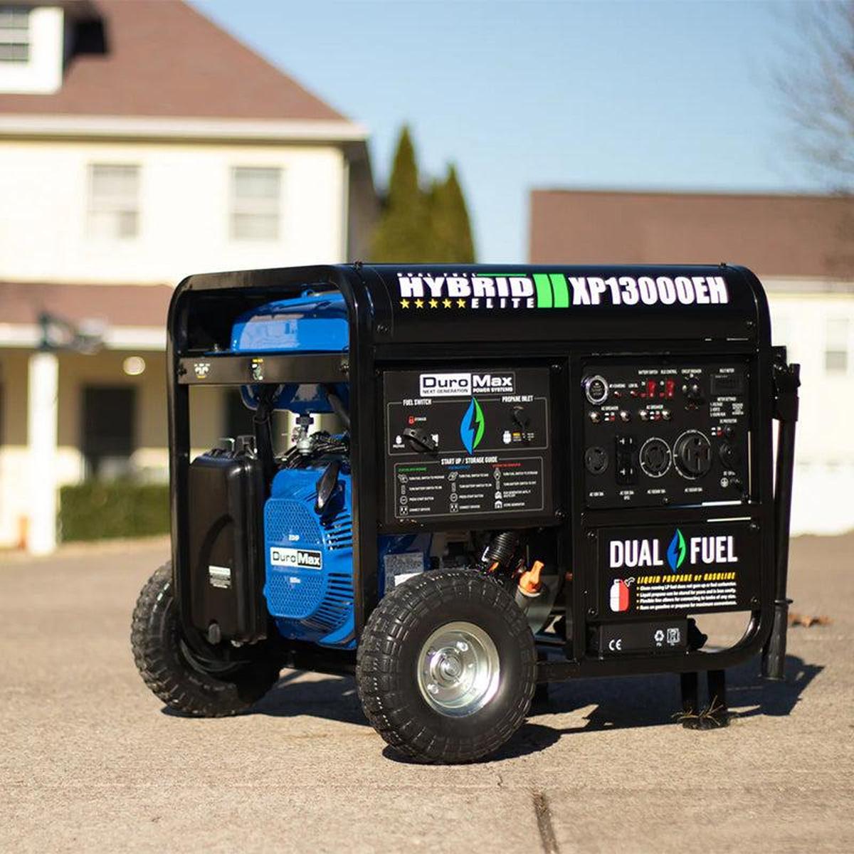 DuroMax XP13000EH generator positioned on a sunny driveway, ready to provide portable power with an extension cord.