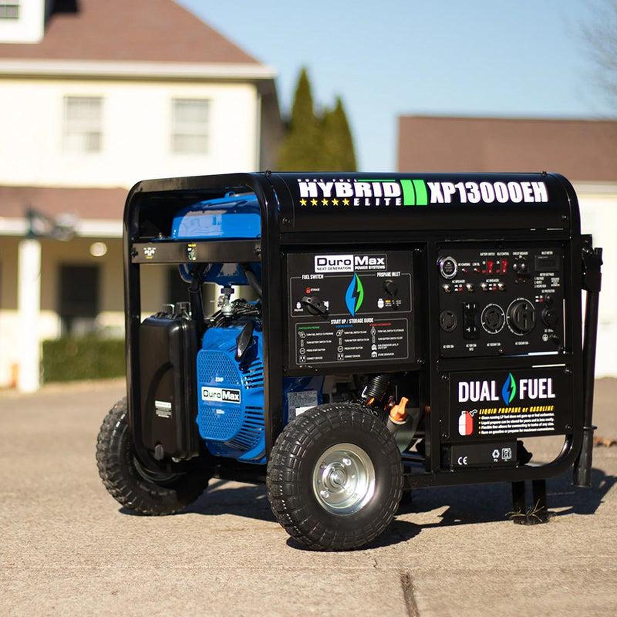DuroMax XP13000EH portable generator set up in a driveway, showcasing its readiness for home or construction use.