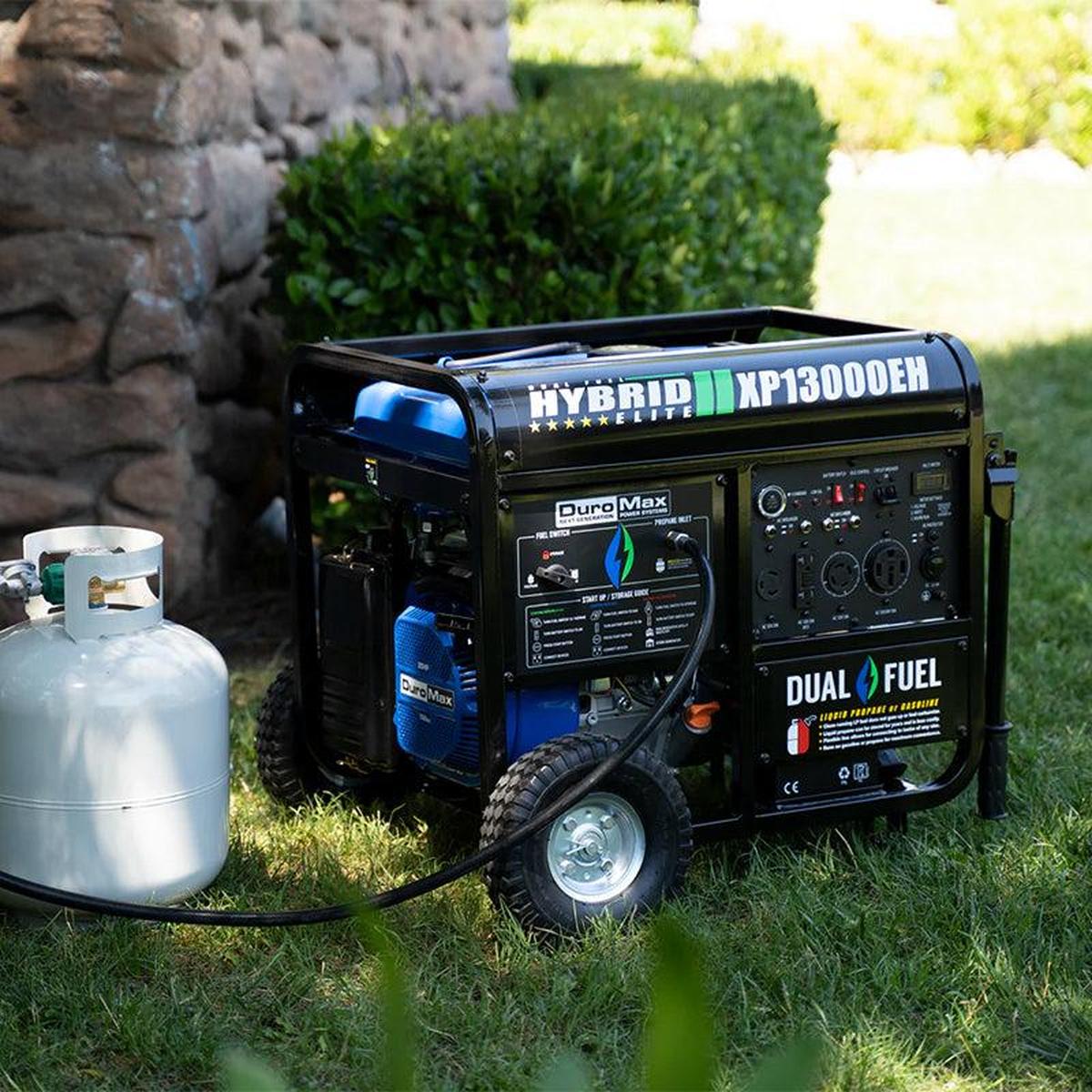DuroMax XP13000EH generator displayed outside a house, showcasing its portability and size.