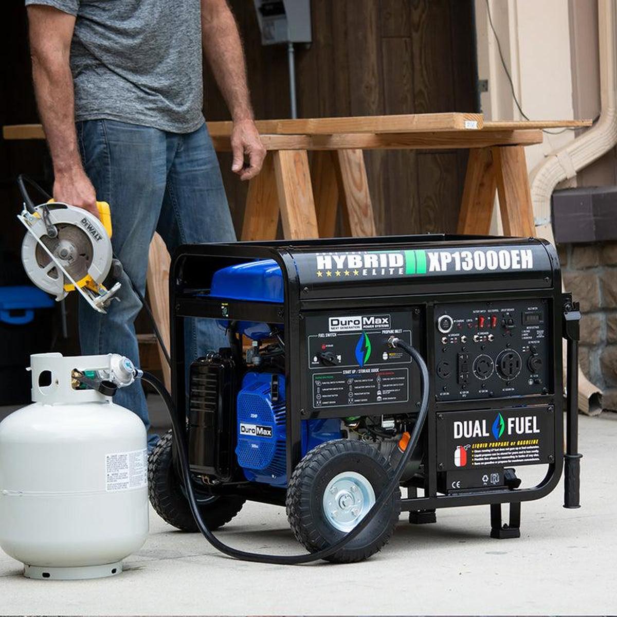 A DuroMax portable generator at a construction site, equipped with an extension cord, ready for heavy-duty tasks.