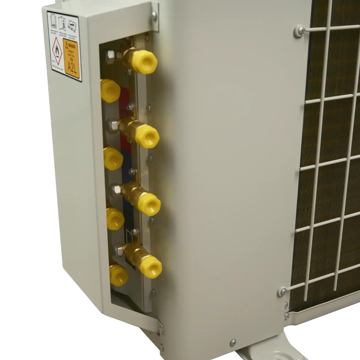 Close-up of a light gray metal air conditioner or heat pump outdoor unit showing the indoor connection side with brass and yellow fittings, a warning label, and part of the condenser coil.